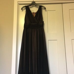 Black Roman-goddess dress with tan underlayer.